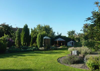 Garden maintenance in Weston On Trent with mown lawn, shaped borders and tidy planting