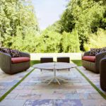 Multicolour sandstone patio seating area with natural stone paving in Aston On Trent