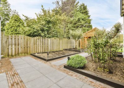 Landscaping in Chaddesden with paved patio area, brick edging and raised beds