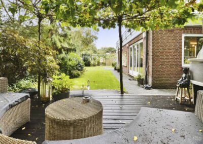 Hardwood decking seating area with pergola-style canopy and garden view at a home in Heatherton