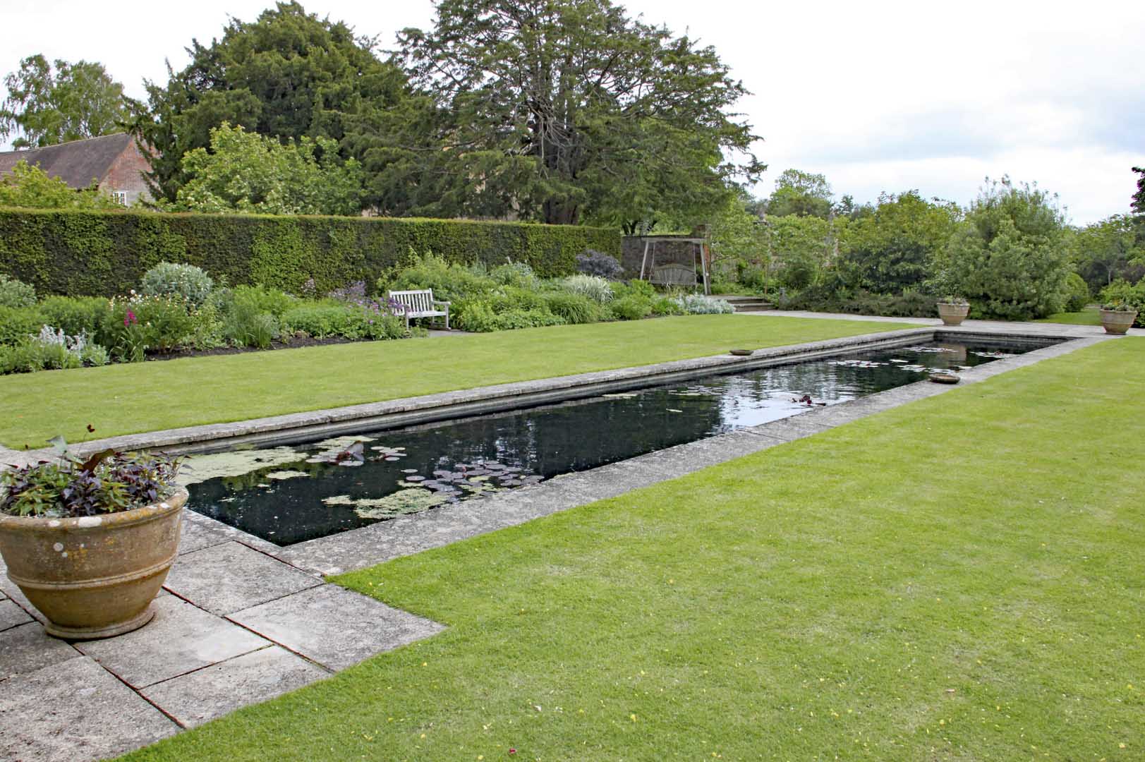 Garden maintenance in Breadsall with a formal lawn, long pond and maintained borders